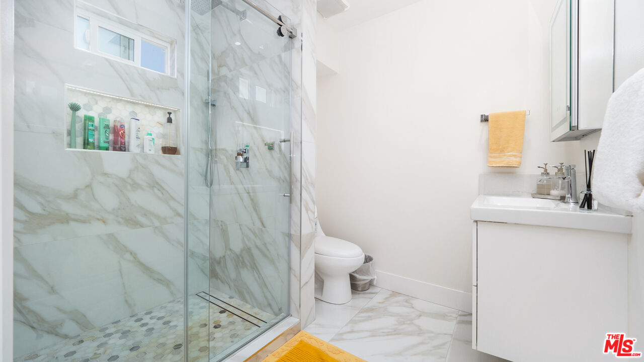 2655 Saxon Drive Los Angeles, CA 90065 - Photo 25 of 40 a bathroom with a sink toilet and shower