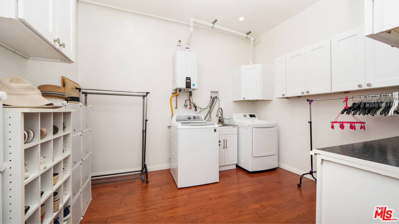 2655 Saxon Drive Los Angeles, CA 90065 - Photo 5 of 40 a view of a kitchen with white cabinets and white appliances