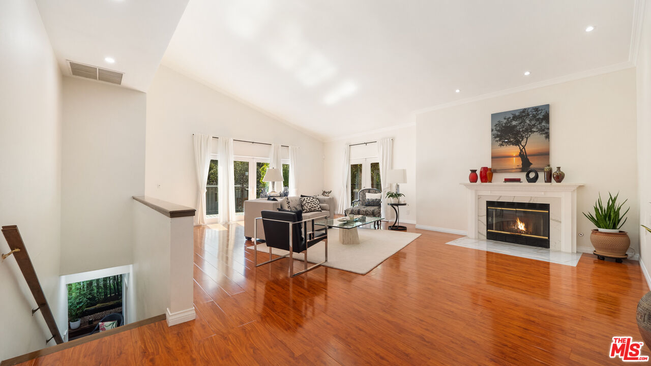 2655 Saxon Drive Los Angeles, CA 90065 - Photo 6 of 40 a living room with furniture and a fireplace