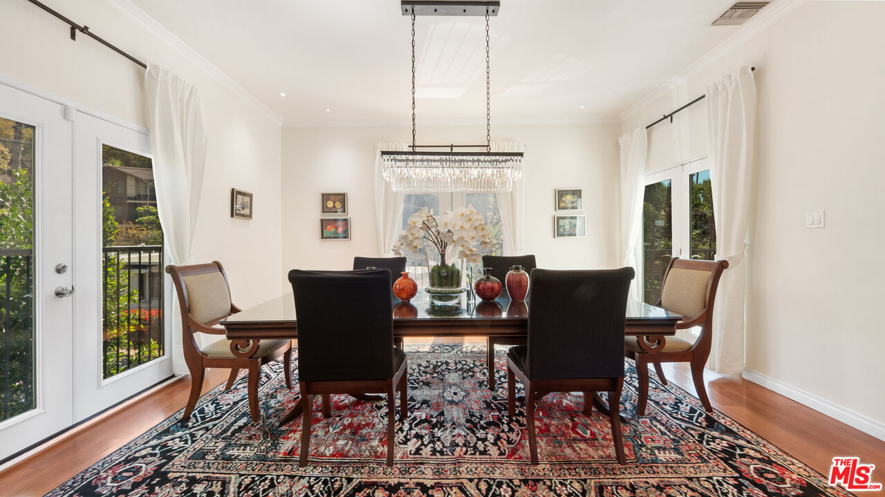 2655 Saxon Drive Los Angeles, CA 90065 - Photo 10 of 40 a view of a dining room with furniture window and wooden floor