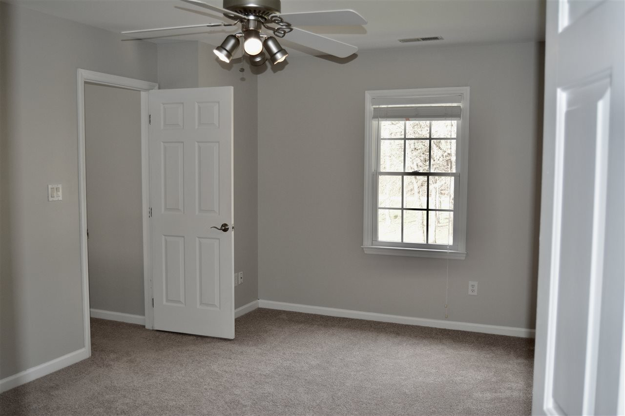 1625 Martin Pond Road Wendell, NC 27591 - Photo 17 of 30 Master bedroom with ceiling fan. Large enough to have a sitting area, with French doors leading into the masterbath. Master Bedroom