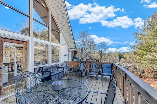 a view of a dinning tables and chairs in the balcony