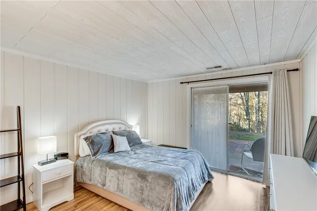 a bathroom with a sink vanity mirror and toilet