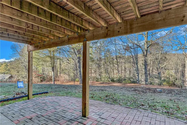 a view of a porch with wooden floor