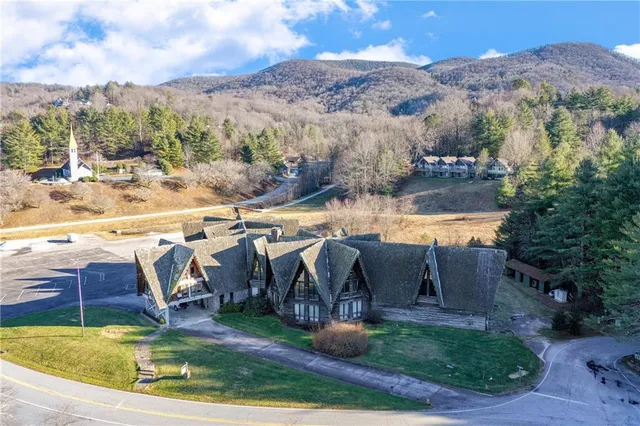 an aerial view of a house with a ocean view