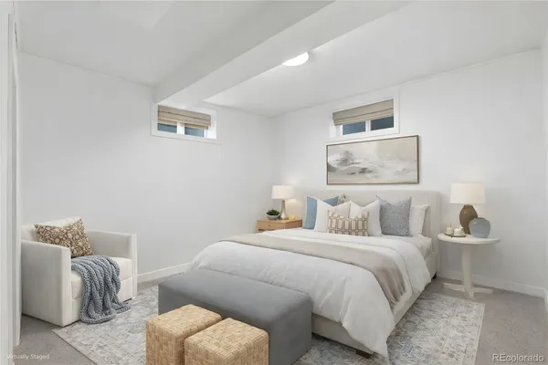 a bedroom with a bed and a couch