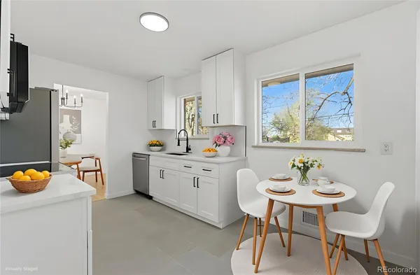 a very nice looking dining room with a table and chairs