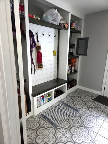 a bedroom with a bed and walk in closet