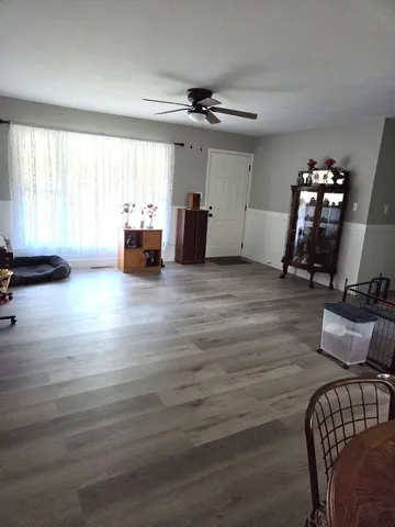 a view of a room with gym equipment and a window