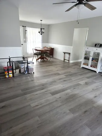 a living room with furniture and a table