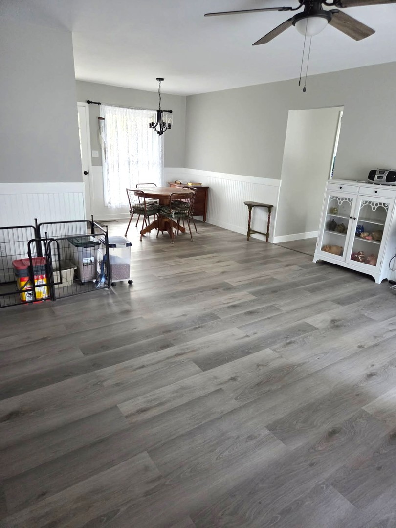 217 East Holiday Drive Decatur, IL 62526 - Photo 3 of 12 a living room with furniture and a table