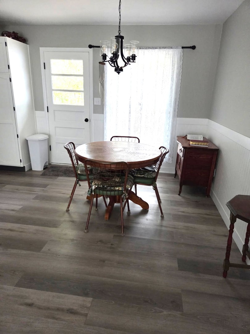 217 East Holiday Drive Decatur, IL 62526 - Photo 4 of 12 a view of a dining room with furniture window and wooden floor