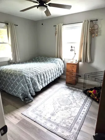 a bedroom with a bed and a dresser