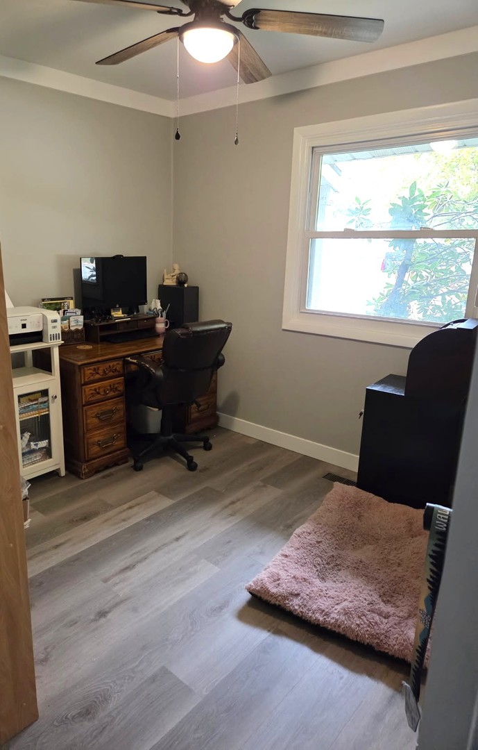217 East Holiday Drive Decatur, IL 62526 - Photo 9 of 12 a living room with furniture and a flat screen tv