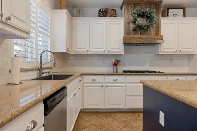 a living room with furniture fireplace and window