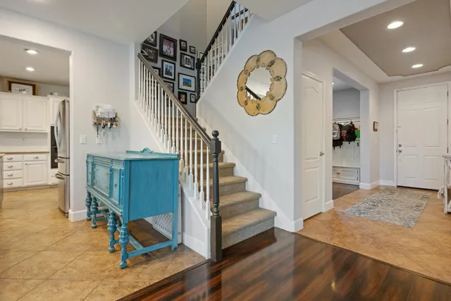 a living room with furniture and kitchen