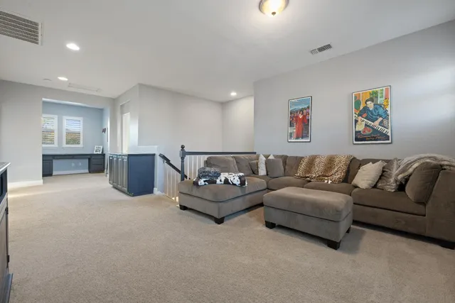 a bathroom with a granite countertop toilet sink mirror and shower