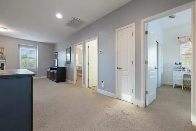 a bedroom with bed and a chandelier