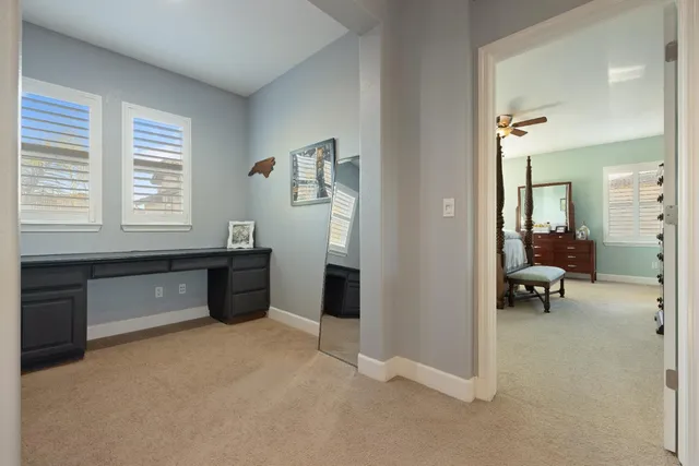 a spacious bathroom with a granite countertop sink mirror and a