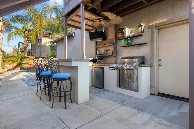 a living room with furniture a dining table and a window