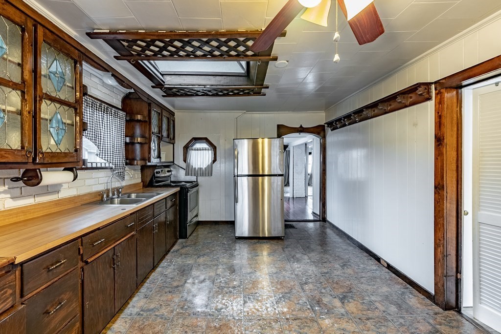 51 Littleton Street Springfield, MA 01104 - Photo 20 of 36 a view of a kitchen with a sink and a refrigerator