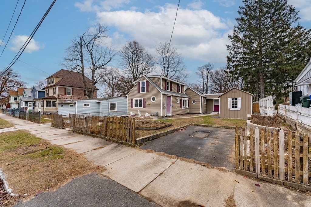 51 Littleton Street Springfield, MA 01104 - Photo 3 of 36 a front view of a house with a yard