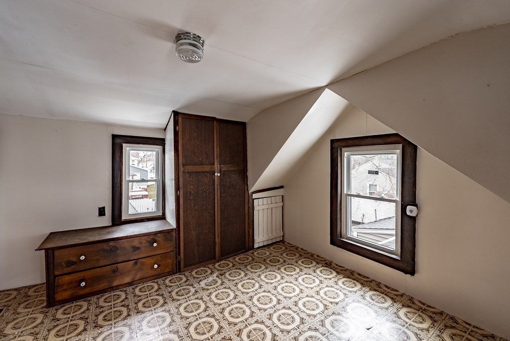 51 Littleton Street Springfield, MA 01104 - Photo 32 of 36 a view of an entryway with wooden floor and windows