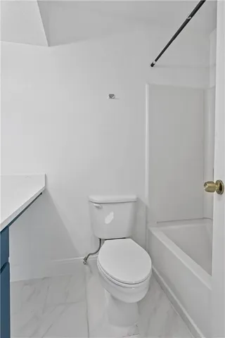 a bathroom with a sink vanity and mirror
