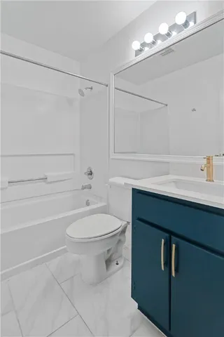 an empty room with closet and a chandelier fan