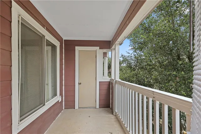 a view of a porch with a door