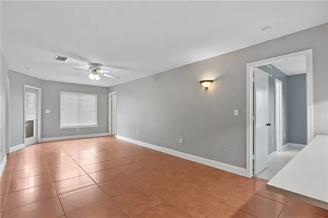 a view of an empty room with glass door