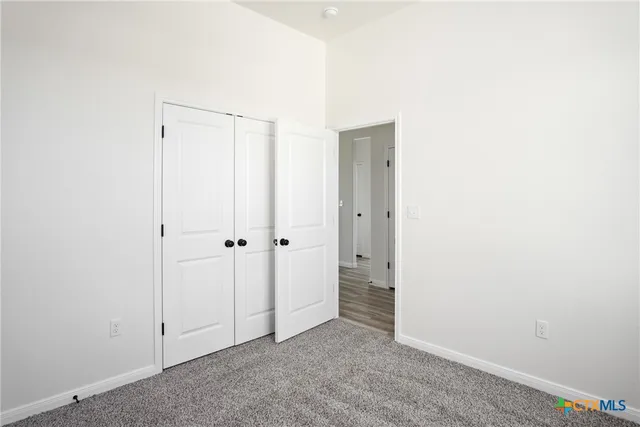 a view of a house with yard and sitting area
