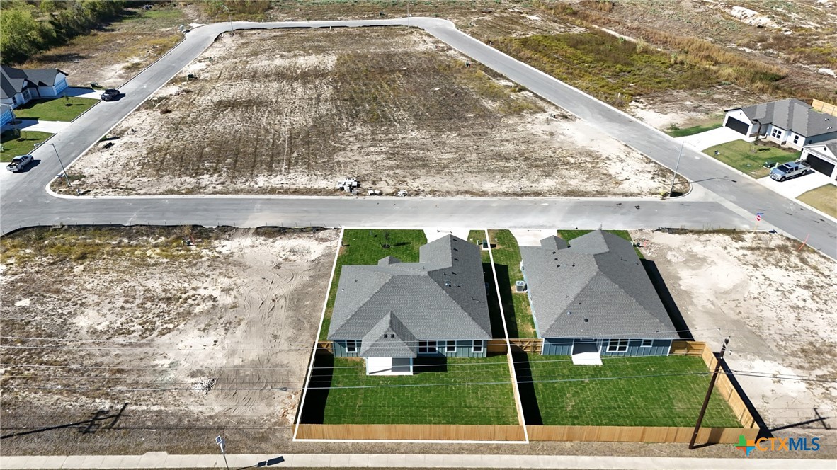 1013 Lago Azul Lane Temple, TX 76504 - Photo 31 of 32 a view of swimming pool with a garden and plants