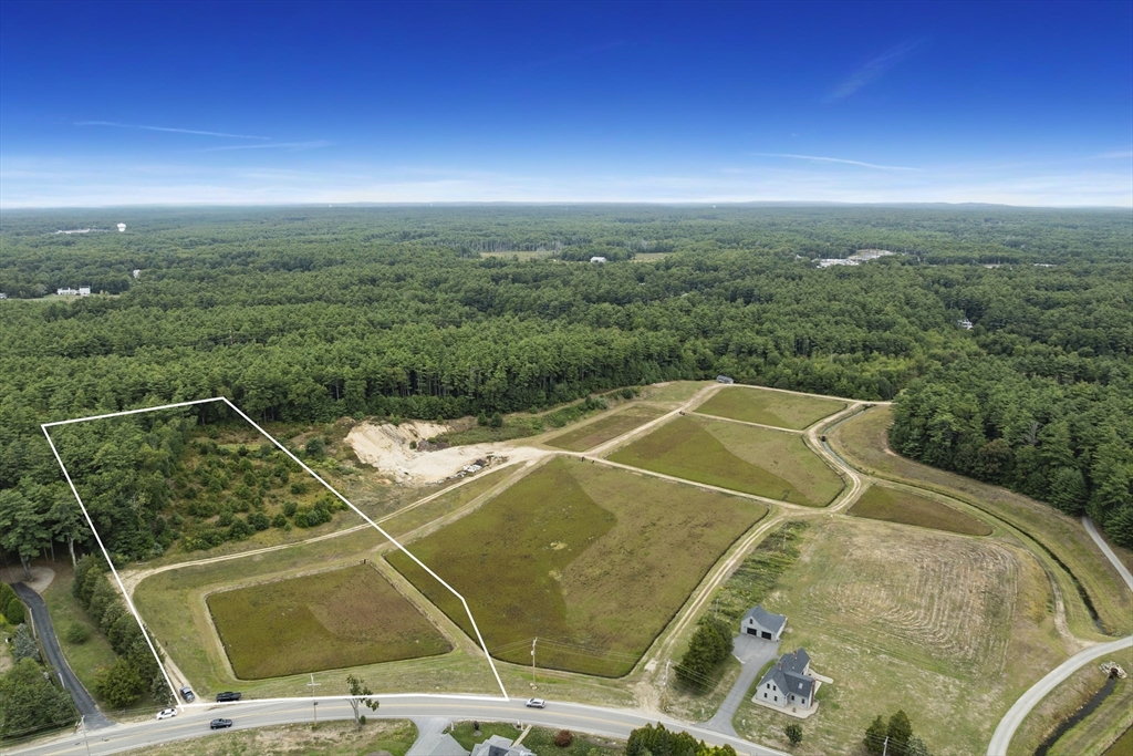 a view of a swimming pool with a yard