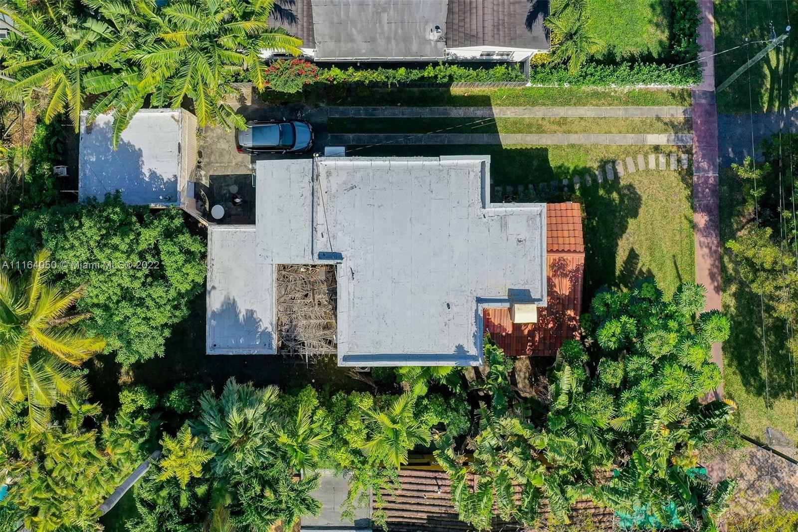 3010 Alton Road Miami Beach, FL 33140 - Photo 4 of 9 an aerial view of a house with a yard