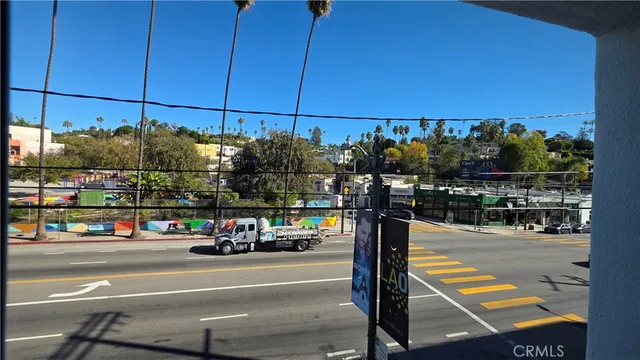a view of a city street with cars