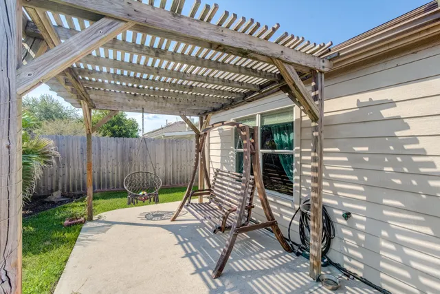 a view of a chair and table in the patio