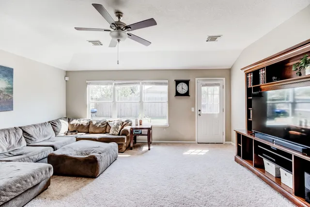 a living room with furniture and a window