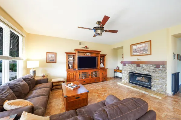 a living room with furniture and a fireplace