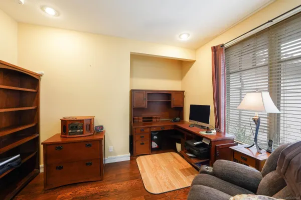a workspace with furniture and window