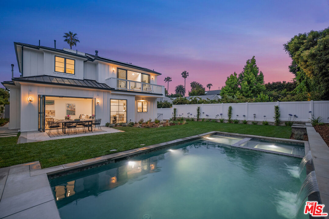 751 North Swarthmore Avenue Pacific Palisades, CA 90272 - Photo 1 of 50 a view of house with swimming pool yard and outdoor seating