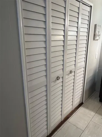 a bathroom with a sink vanity and mirror