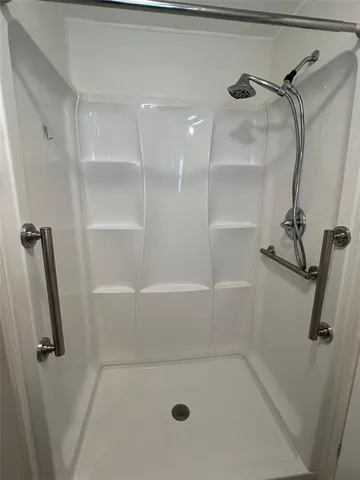 a bathroom with a sink vanity and a mirror