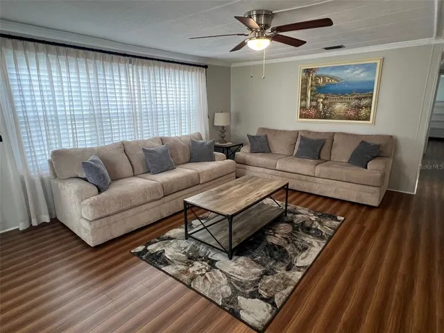 a living room with furniture and a rug