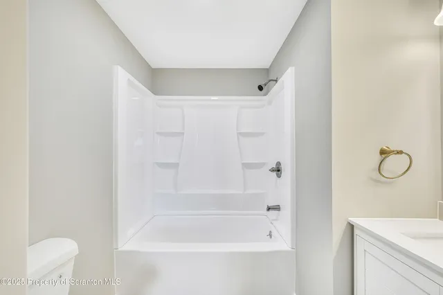 a bathroom with a shower a bath tub and a sink