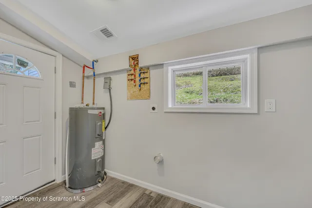a view of a storage & utility room with a window