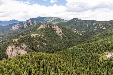 a view of a city with mountains in the background