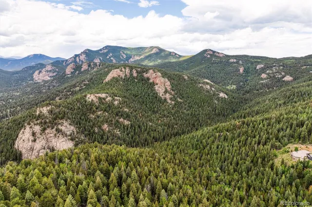 a view of a city with mountains in the background