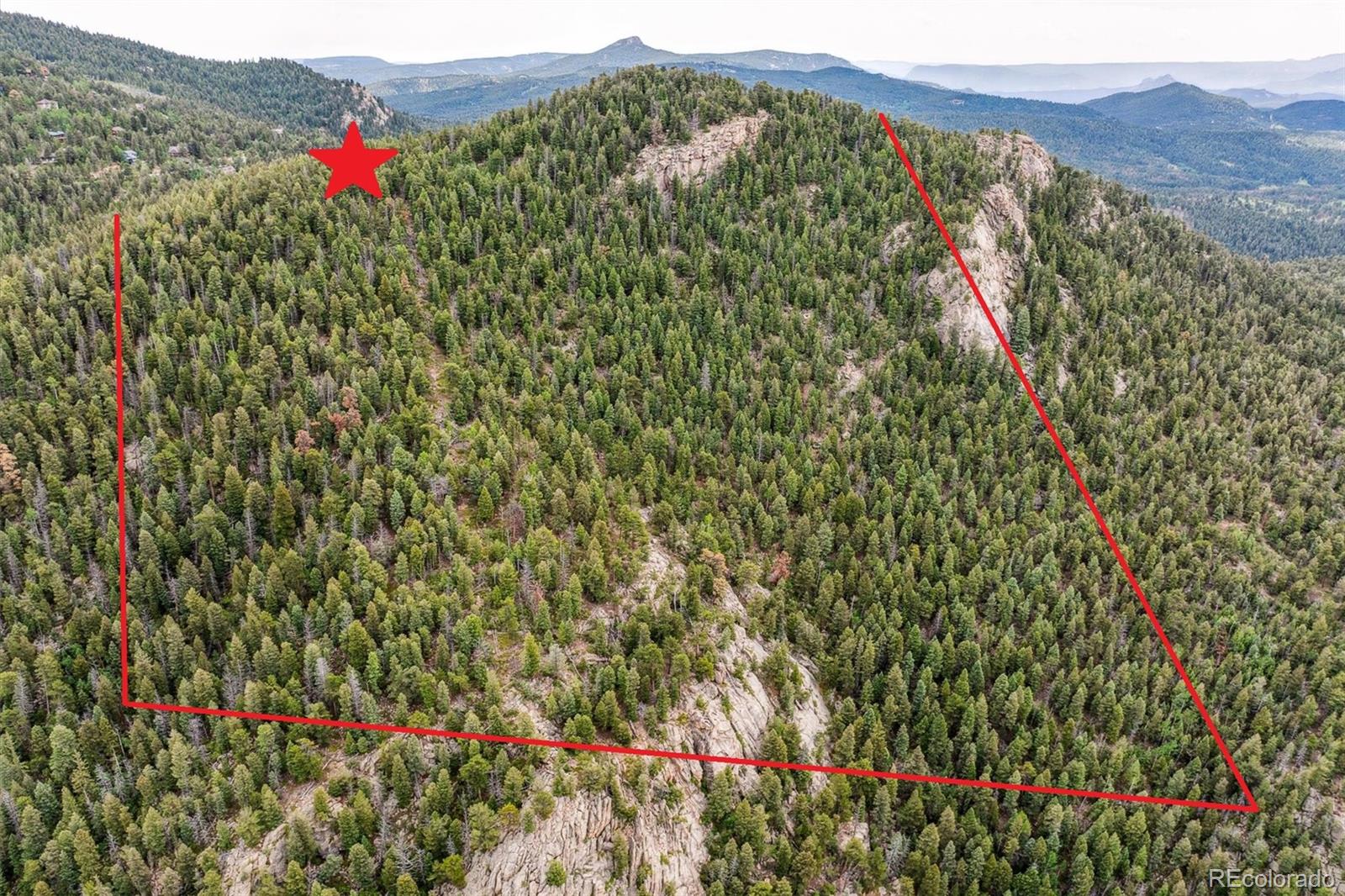 0 Pike View Drive Conifer, CO 80433 - Photo 3 of 31 a view of a lush green field with a flower in a yard