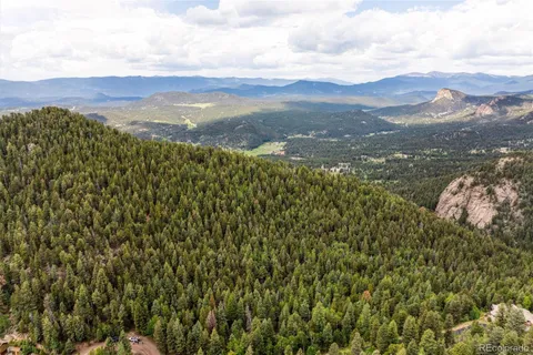 a view of a large body of water with a mountain in the background